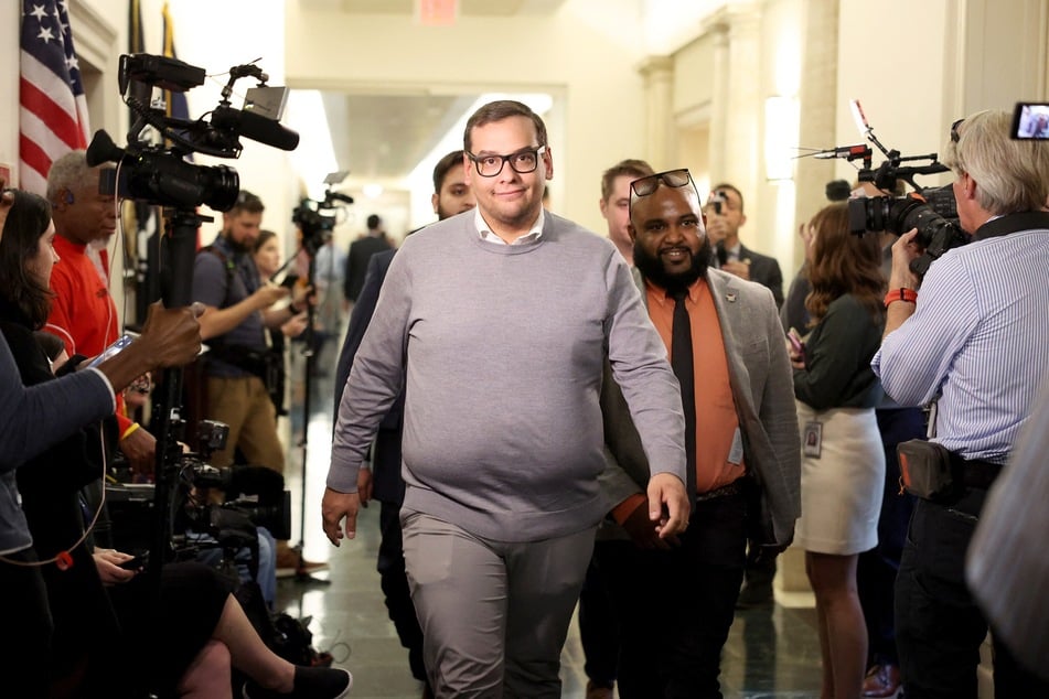 A lawyer representing a former treasurer for George Santos (pictured) has now changed course about his client, and has apologized for any past false statements on the case.