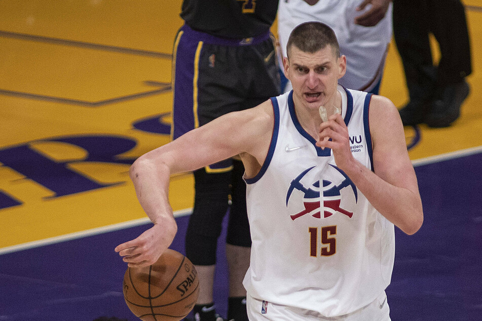 Nuggets star Nikola Jokic reacted badly to a foul by the Heat's Markieff Morris.