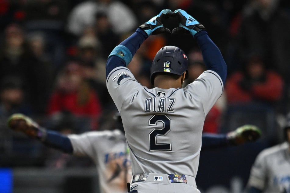 Tampa Bay Rays designated hitter Yandy Diaz celebrates while he rounds the bases after hitting a two-run home run against the Cleveland Guardians during the ninth inning in game four of the ALCS.