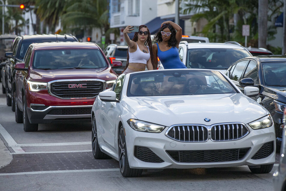 Spring breakers have been pouring on to party hotspots like Miami's South Beach.