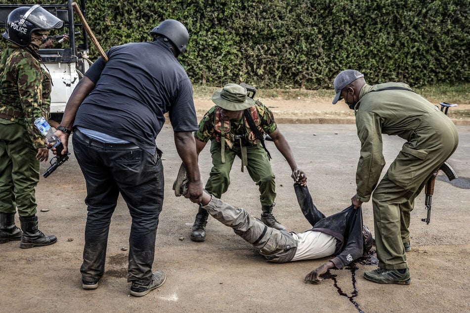At least one person shot dead as Kenyan protests at US Ebola center take violent turn