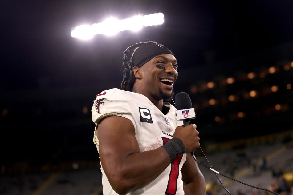 Bijan Robinson of the Atlanta Falcons talks with the media after defeating the Green Bay Packers at Lambeau Field on September 24, 2026.