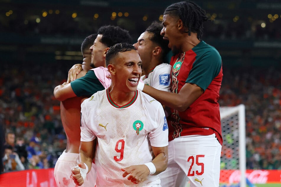 Soufiane Rahimi and teammates celebrate after the penalty shootout as Morocco qualify for the round of 16 stage of the World Cup on June 29, 2026.