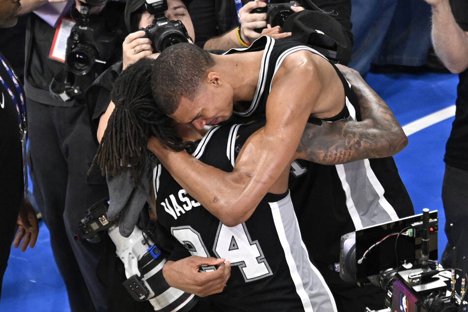 San Antonio Spurs forward Victor Wembanyama (r.) celebrates with guard Devin Vassell after defeating the Oklahoma City Thunder in game seven of the Western Conference Finals.