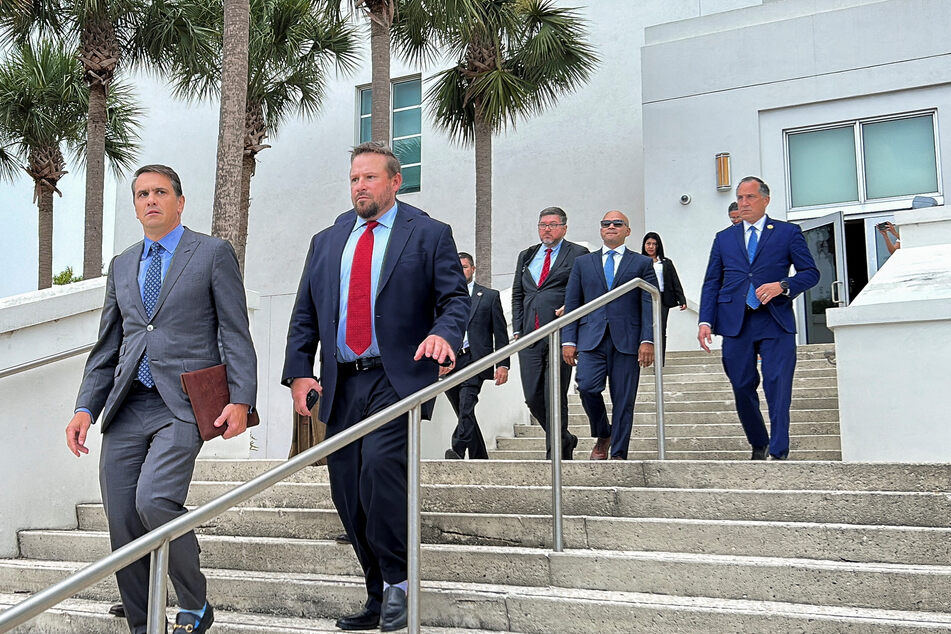 Trump's former aides Walt Nauta (2nd from r.) and Carlos de Oliveira are co-defendants in the classified documents case.