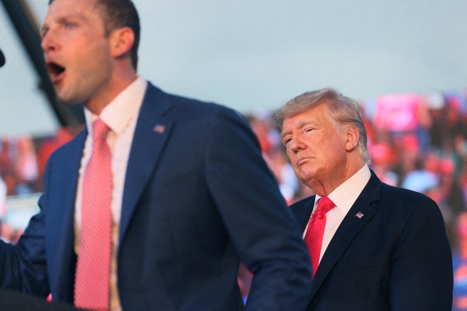 Congressman Max Miller (l) speaks at a rally with President Donald Trump in 2021.