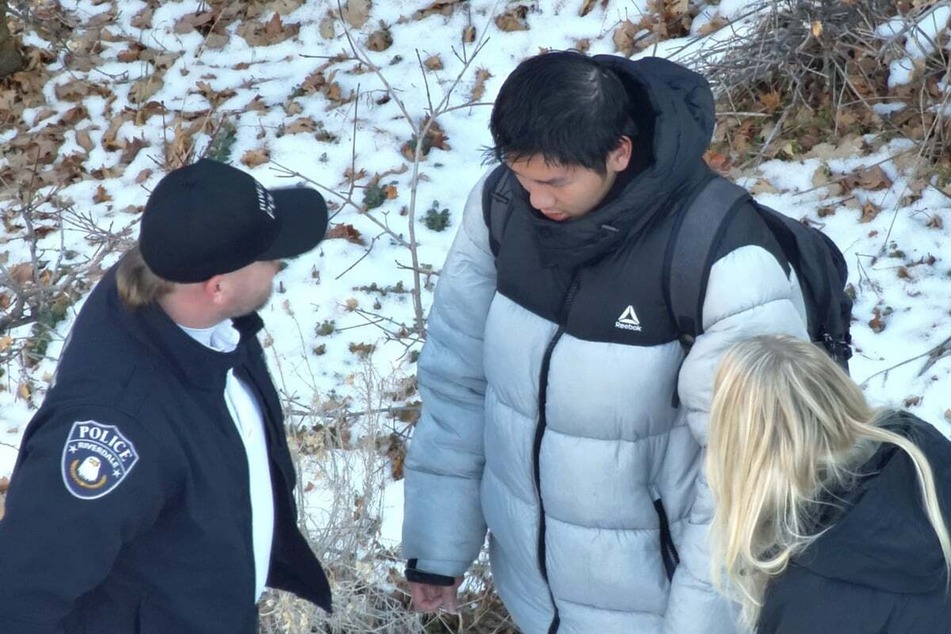 Kai Zhuang with emergency services during his rescue.