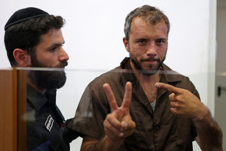 Brazilian activist Thiago Avila gestures upon his arrival at an Israeli court in Ashkelon on May 3, 2026.