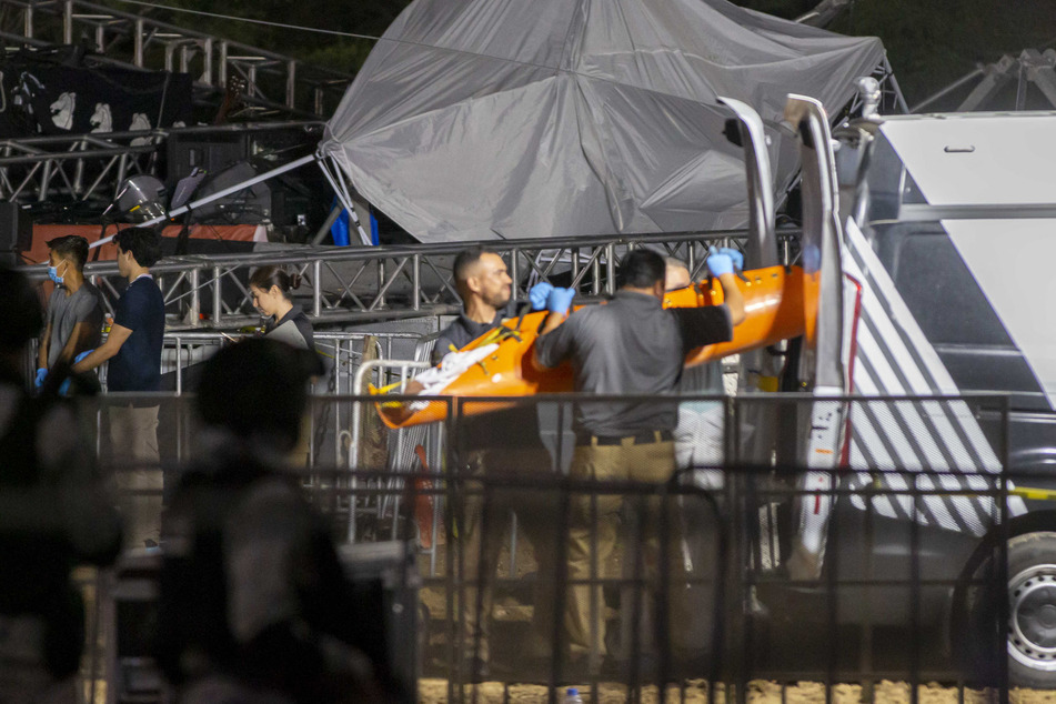 Forensic personnel move a body after a stage collapsed during a campaign rally for Mexican presidential candidate Jorge Alvarez Maynez in Mexico, on Wednesday.