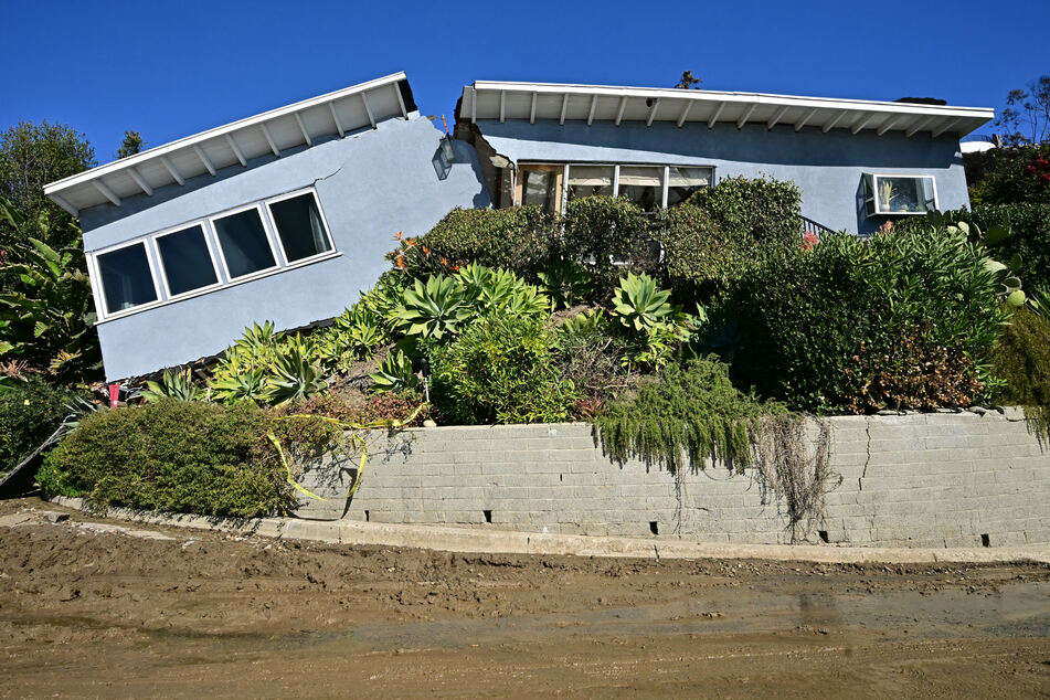 Photographs from the Pacific Palisades area showed one home – undamaged by the fire – that appeared to have broken in two after the flames were extinguished when part of a hillside collapsed.