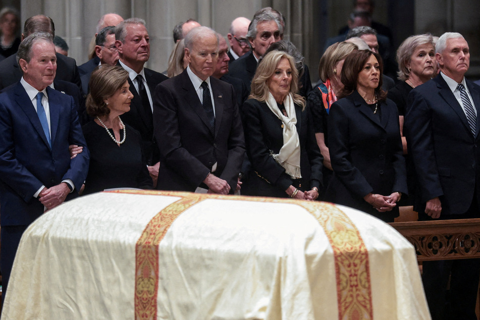 (From l. to r.) George and Laura Bush, Joe and Jill Biden, Kamala Harris, and Mike Pence were all in attendance at Thursday's funeral procession.