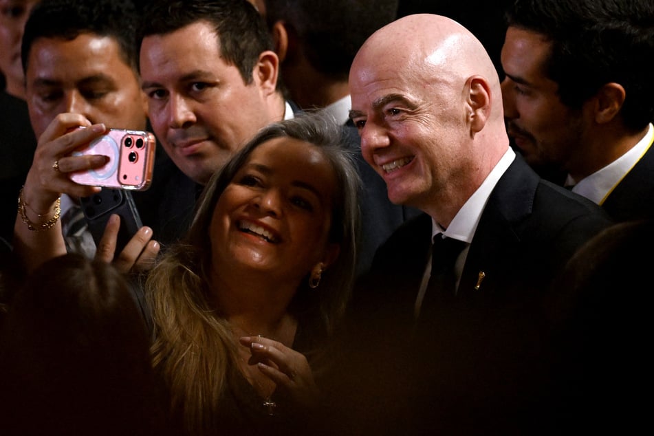 FIFA President Gianni Infantino poses for a selfie while attending the swearing-in ceremony of Colombia's new far-right President Abelardo de la Espriella.