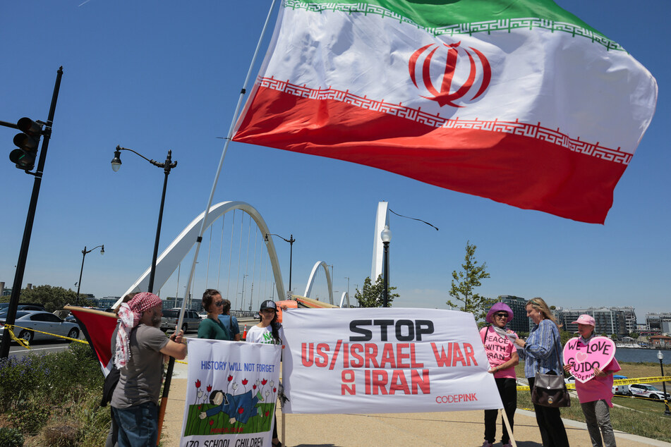 Protesters against the war in Iran gather at the base of the Frederick Douglass Memorial Bridge in Washington DC on May 5, 2026.