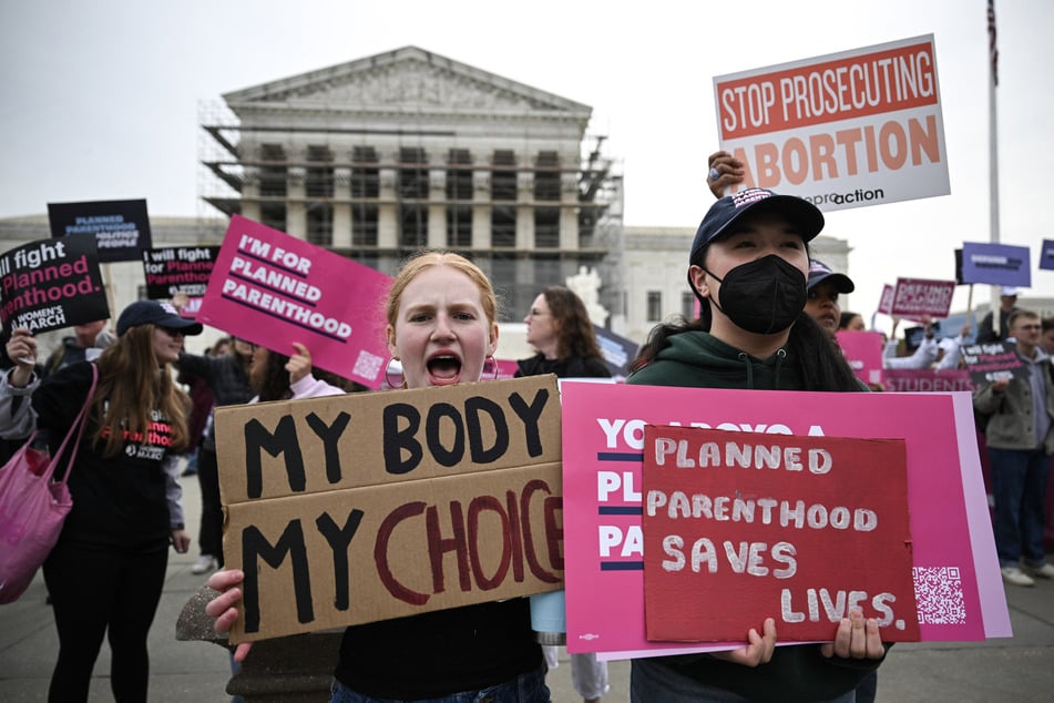 Supporters of Planned Parenthood and pro-choice supporters rally outside the US Supreme Court on Wednesday, in Washington, DC.