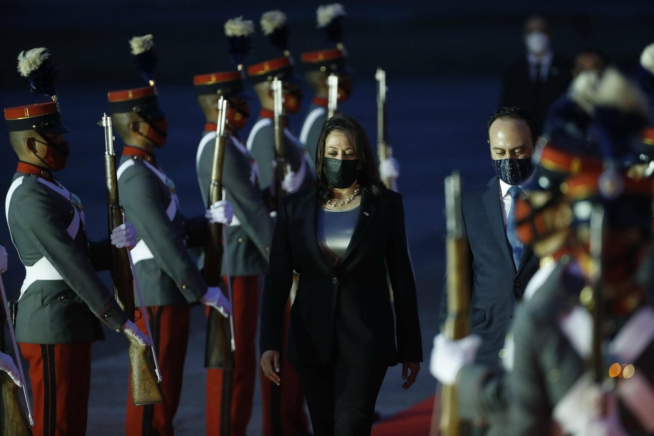 Kamala Harris and Guatemalan Minister of Foreign Affairs Pedro Brolo depart the plane in Guatemala City.