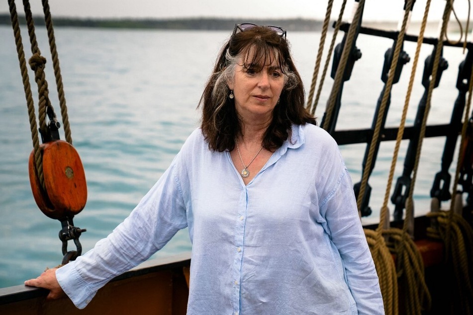 Sarah Darwin, descendant of Charles Darwin, stands onboard the Oosterschelde in Puerto Ayora, Galapagos, Ecuador.