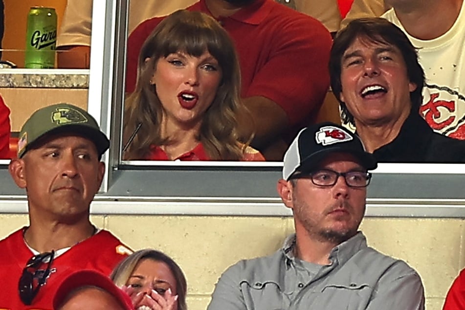 Tom Cruise (r) spilled on his chat with Taylor Swift while attending the Kansas City Chiefs game against the Denver Broncos on Monday.