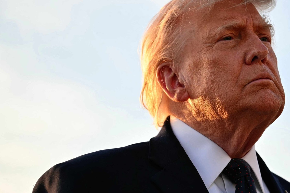 Trump signs hard copy of deal to end Iran war at Palace of Versailles