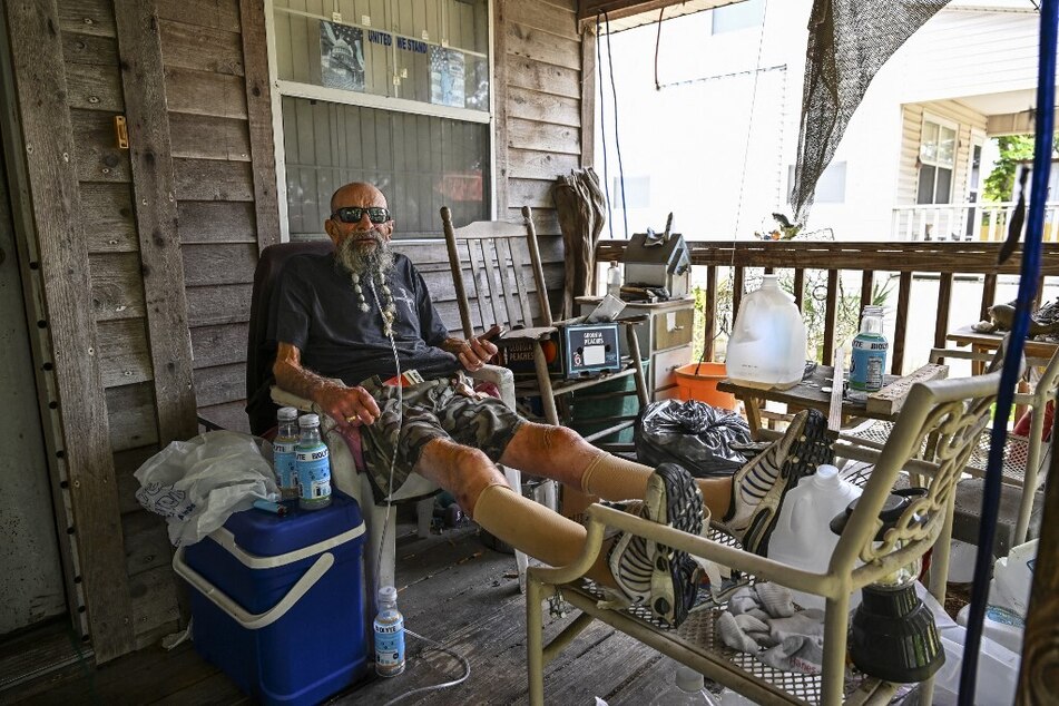 John Paul Nohelj looks on as he stays in his house before hurricane Idalia hits in Steinhatchee, Florida, on August 29, 2023.