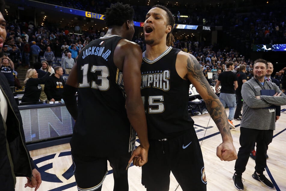 Jaren Jackson Jr. and Brandon Clark celebrate as the Memphis Grizzlies achieve a franchise record 11th straight win.