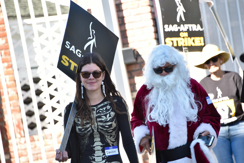 Striking SAG-AFTRA actors shunned Barbie and Oppenheimer costumes, sending a message to studio bosses.