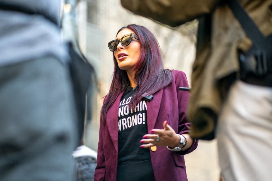 Laura Loomer speaks to the media prior to the beginning of former President Donald Trump's Trial at Manhattan Criminal Court on April 15, 2024 in New York City.