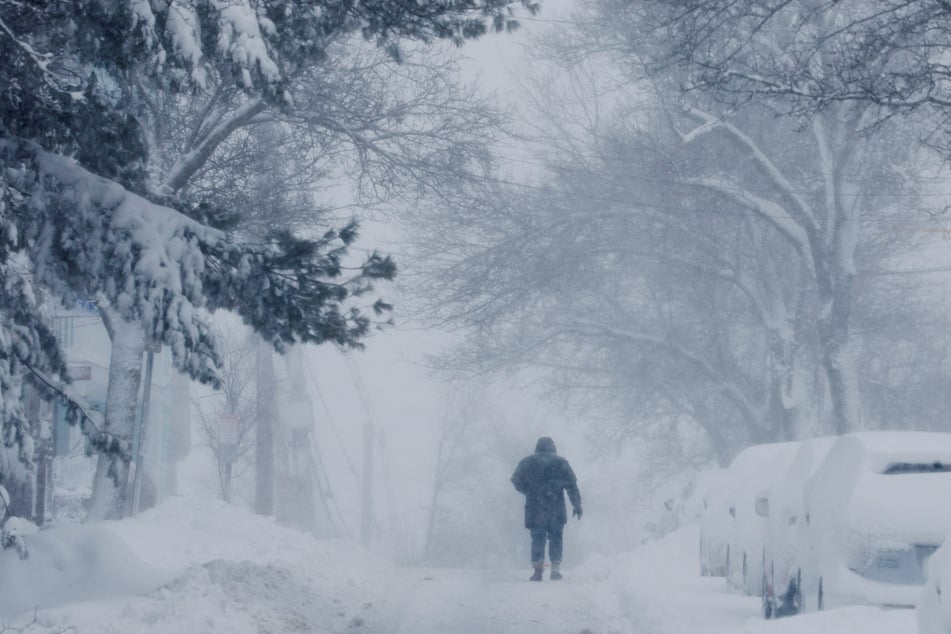 The northeast US continued to suffer from power outages on Tuesday as the fallout of a massive winter storm led to continued school closings.