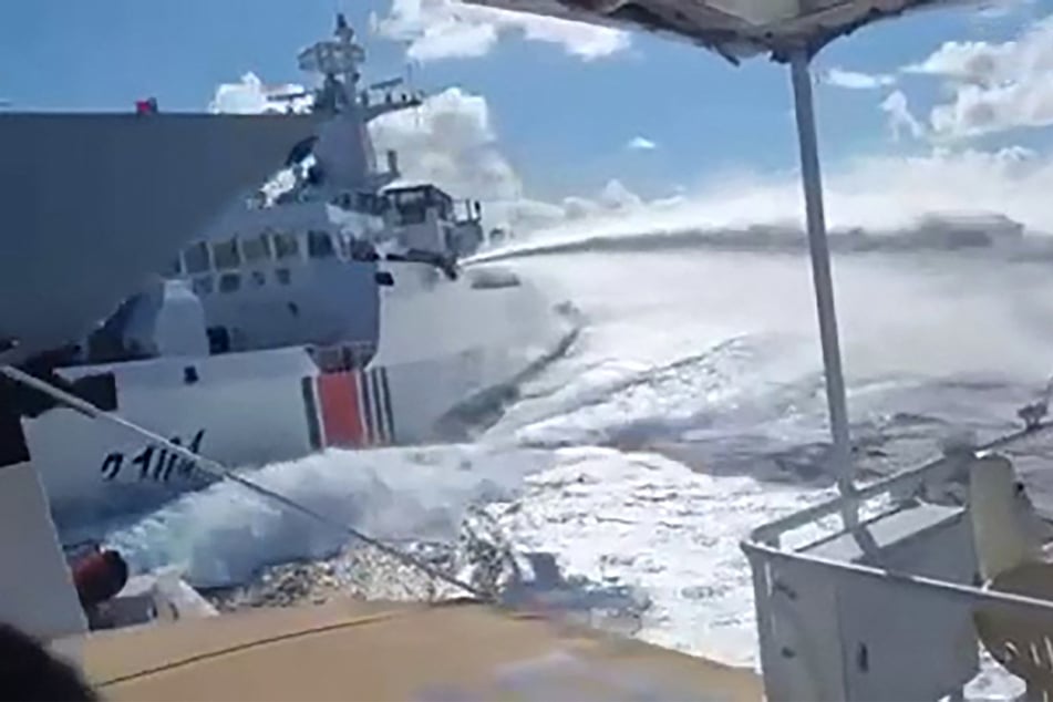 A Chinese Navy vessel attacks a Filipino fisheries boat near the Scarborough Shoal in the South China Sea on August 11, 2025.