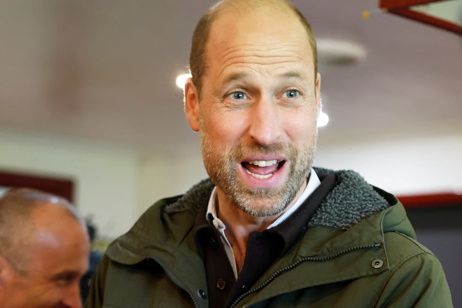 Prince William meets representatives from the club's senior and youth teams while visiting Bute Shinty Club in Rothesay, Scotland, on September 17. The British royal recently made a rare TV appearance on The Graham Norton Show.