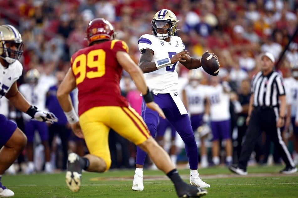 Michael Penix Jr. (r) lit up the field on Saturday against USC, dropping a series of eye-popping throws.