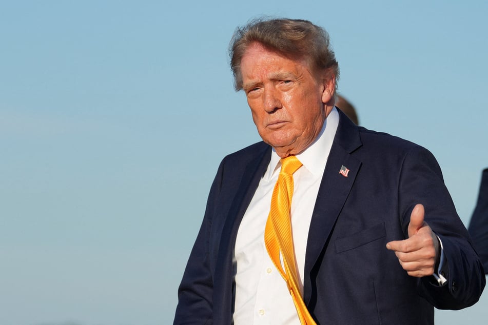 President Donald Trump gives a thumbs up after exiting Air Force One at Morristown Municipal Airport in New Jersey on September 4, 2026.