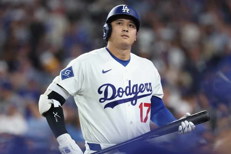 Shohei Ohtani #17 of the Los Angeles Dodgers reacts after striking out against the Milwaukee Brewers on Thursday.