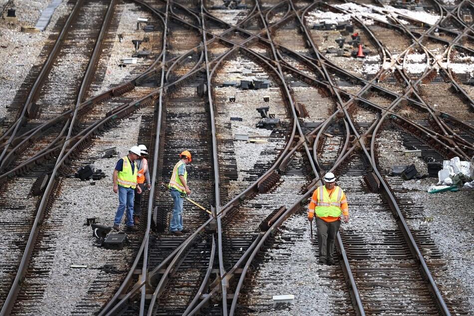 Rail workers reach tentative deal to avoid massive strike – for now