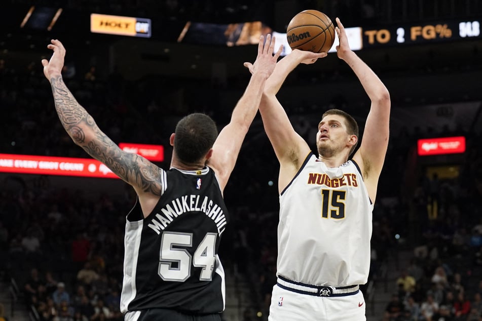 Denver Nuggets center Nikola Jokic shoots over San Antonio Spurs forward Sandro Mamukelashvili during the second half at AT&T Center.