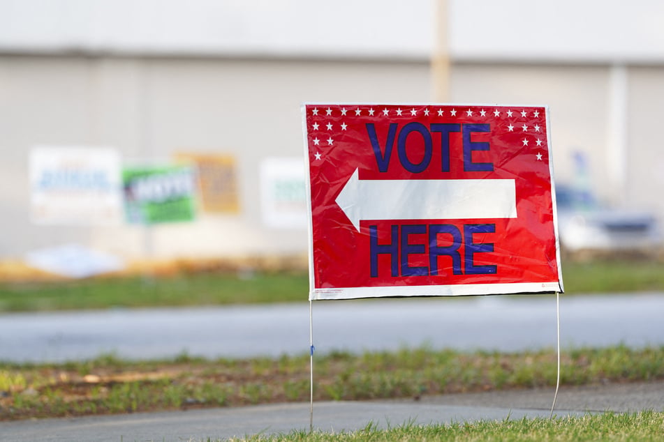 A sign is pictured outside an Atlanta polling site as voters cast their ballots in the Georgia's midterm primaries on May 19, 2026. International election observers have criticized the US for failing to invite them to monitor November's election.