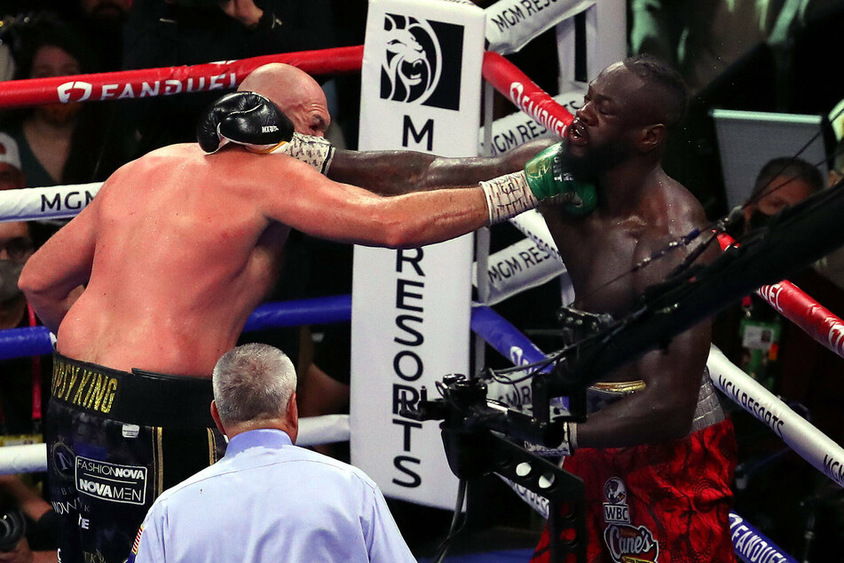 Third time's a charm: Tyson Fury knocks out Deontay Wilder to settle boxing rivalry trilogy