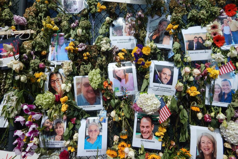 People have placed tributes to deceased and missing persons at the Surfside Wall of Hope & Memorial.