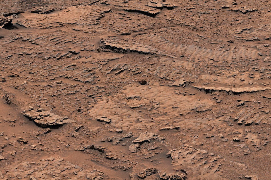 This handout image, taken by NASA's Curiosity Mars rover and released on February 8, 2023, shows a close-up of the rippled textures that were created billions of years ago as waves flowed upon a shallow lake.