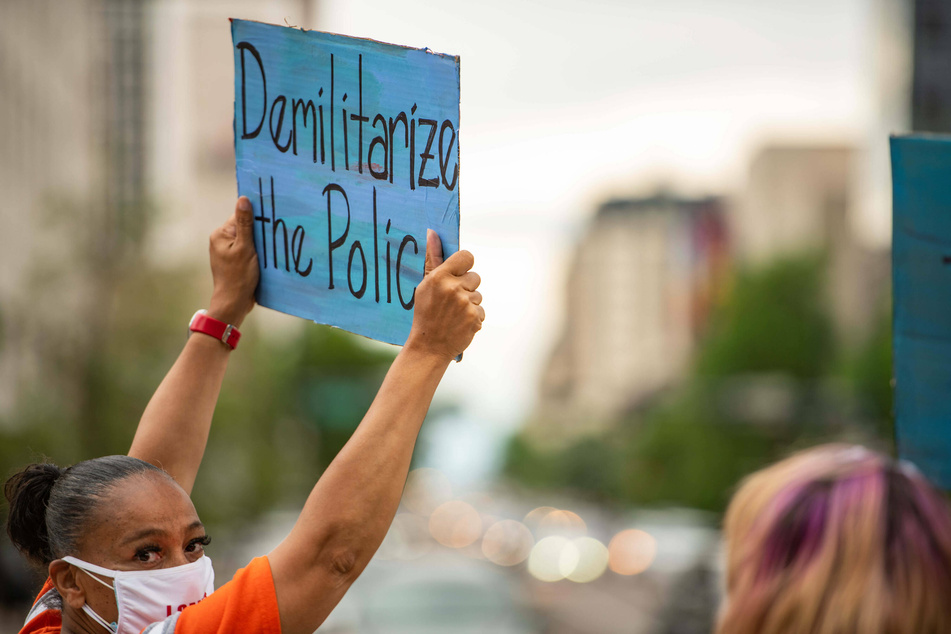 The demand to "defund the police" calls for reduced police budgets and increased allocation of funds to social services.