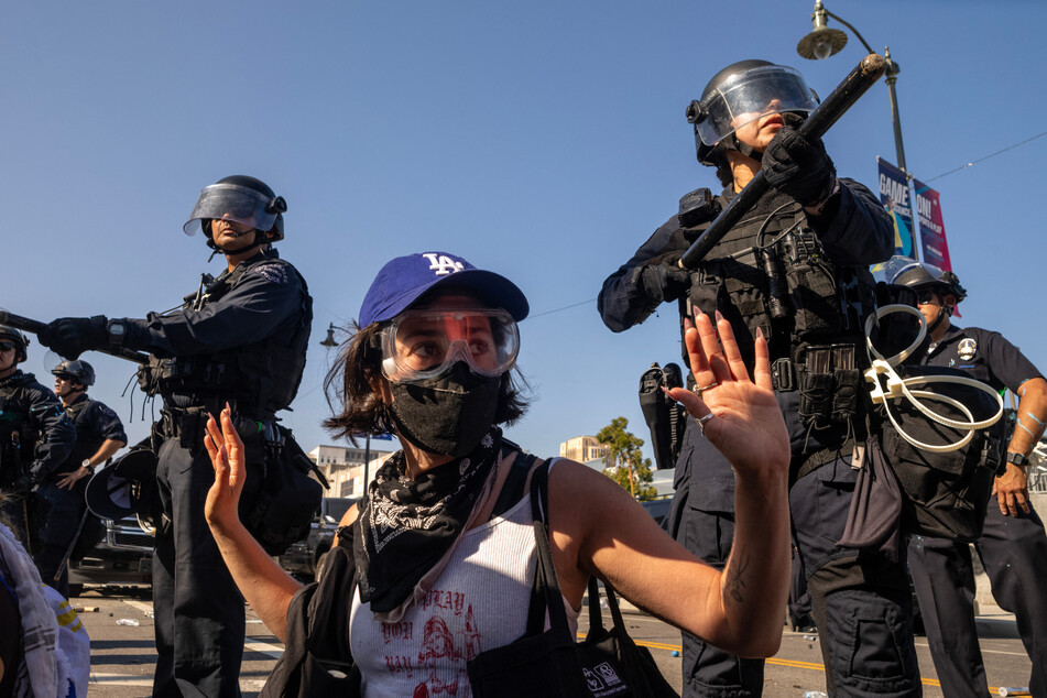 A Human Rights Watch report said law enforcement used excessive force and deliberate brutality against protesters during demonstrations against Trump's immigration crackdown.
