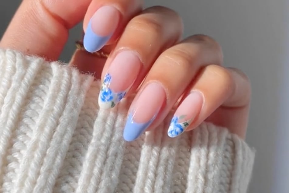 TikToker @glossytipped showed viewers how to create this baby blue pastel nail design.