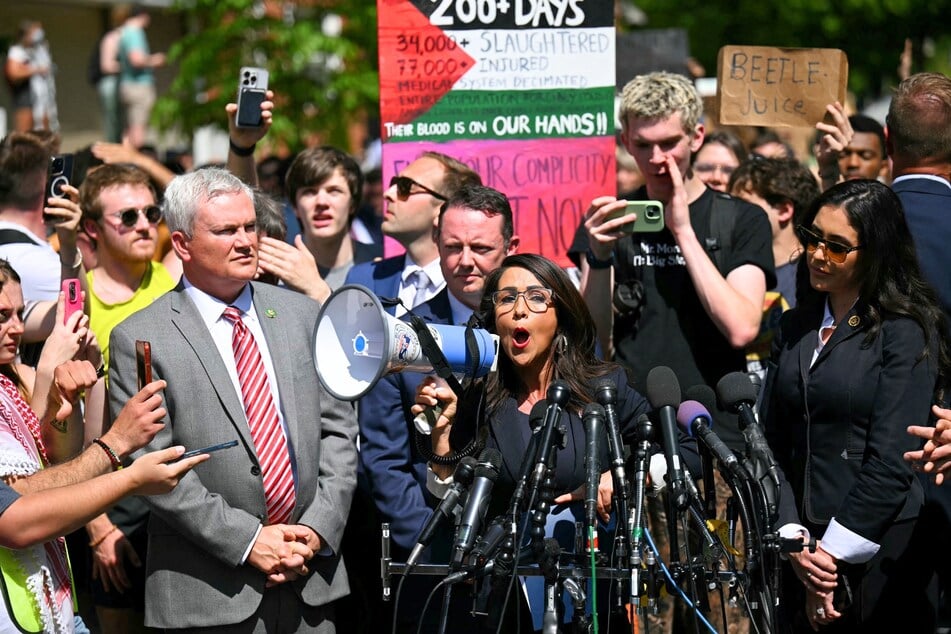 Lauren Boebert using a bullhorn to lecture pro-Palestinian protesters during a visit to George Washington College on May 1, 2024.