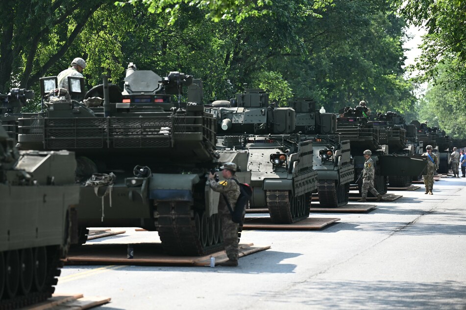 Soldiers prepare military vehicles during a media preview of the Army's Parade at West Potomac Park in Washington DC.
