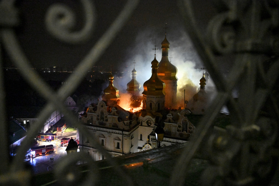 Kyiv's Dormition Cathedral burns on Sunday night as emergency services scramble to respond after Russia launched a wave of attacks against the city.