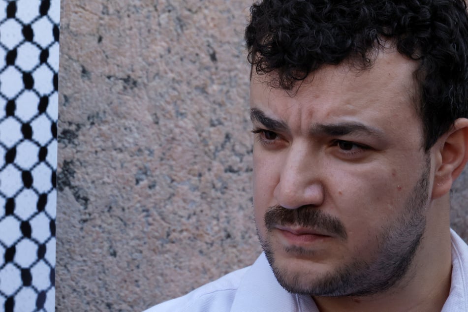 Mahmoud Khalil stands with others announcing a federal lawsuit to be filed against Columbia University for showing "deliberate indifference" to the harassment of pro-Palestinian students during a press conference outside the university gates on September 14, 2026.
