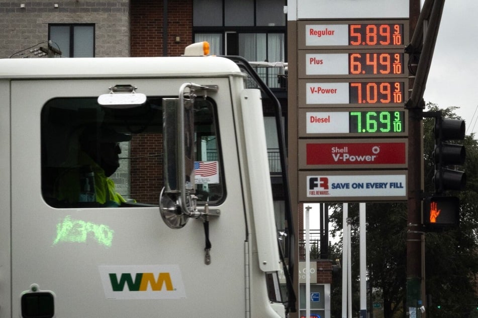 Gas prices are displayed at a station on October 15, 2026, in Chicago, Illinois. US oil giants have doubled their profits since this time one year ago, new reports say.