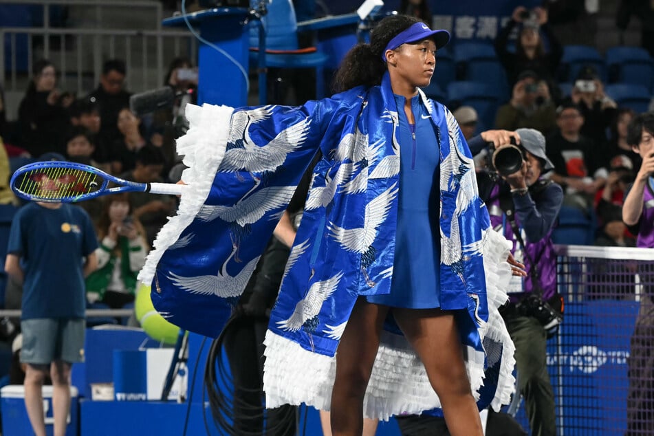 Naomi Osaka walks onto the court in a stunning crane pattern look ahead of her WTA Pan Pacific Open tennis match at Ariake Coliseum in Tokyo, Japan, on October 27, 2026.