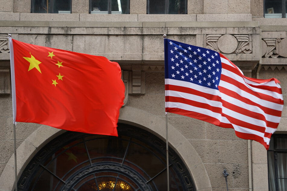 The US State Department has fired an employee who did not acknowledge a romantic relationship with a Chinese national.