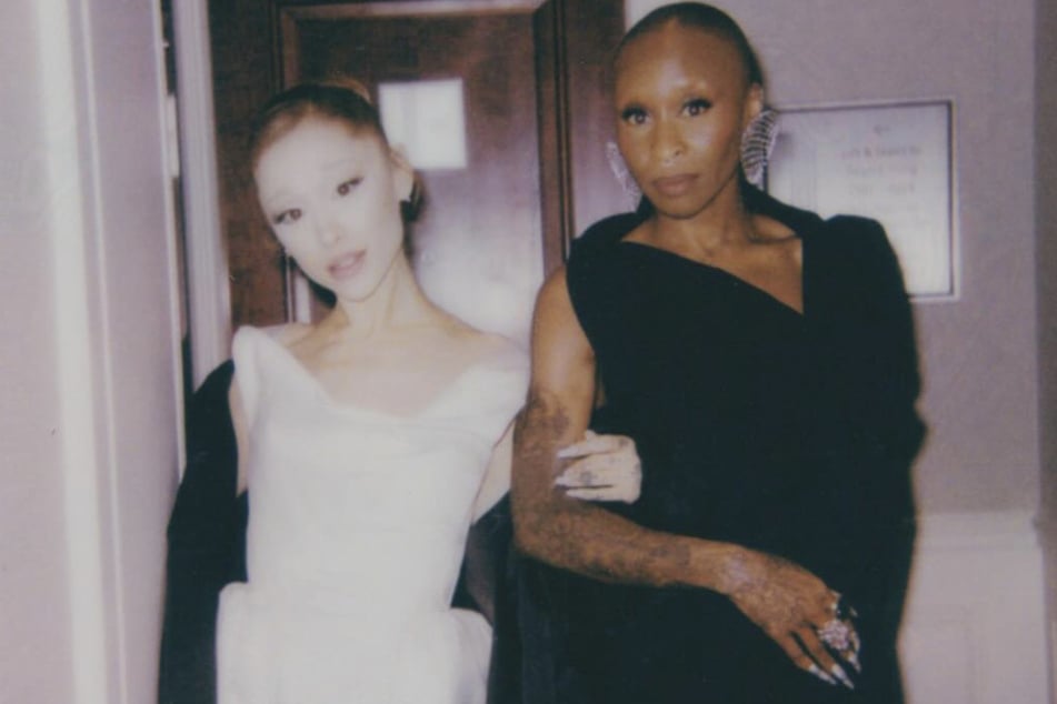 Cynthia Erivo (r.) and Ariana Grande appear in a photo together. The Brit defended her decision to protect Ariana from an erratic fan who charged toward the pop singer during the Singapore premiere of Wicked: For Good.