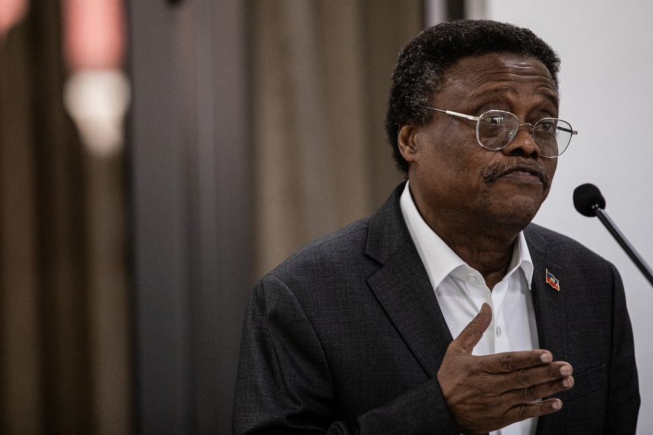 Member of Presidential Council Transitional (CPT) Fritz Alphonse Jean speaks during a press conference at the Villa d'Accueil in Port-au-Prince, Haiti, on Tuesday.